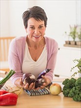 Portrait of mature woman in kitchen