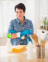 Portrait of mature woman cleaning kitchen
