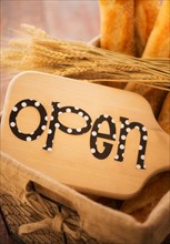 Studio Shot of cutting board with open sign