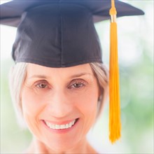 Portrait of woman in graduation cap