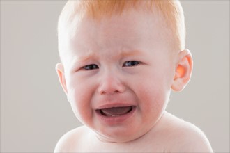 Studio shot portrait of crying baby boy (18-23 months)