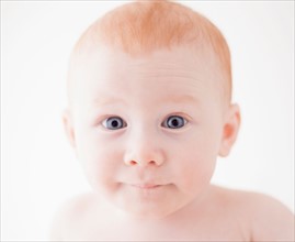 Studio shot portrait of surprised baby boy (18-23 months)