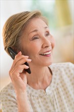 Senior woman talking on phone.