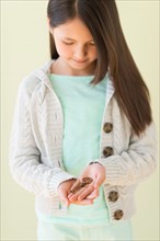 Girl (8-9) holding key.