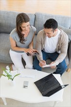 Young couple doing home finances.