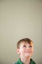 Portrait of boy (4-5) daydreaming