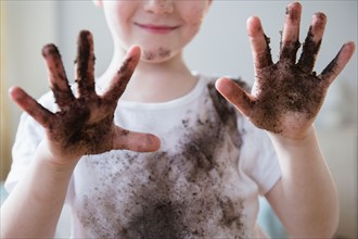Boy (4-5) showing dirty hands