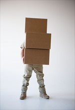 Man holding stack of boxes
