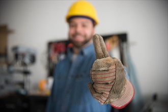 Construction worker with thumb up