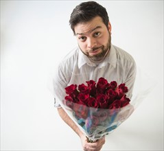 Portrait of man with bouquet