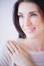 Portrait of smiling woman with engagement ring