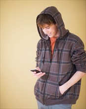Teenage boy (14-15) text messaging