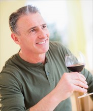 Portrait of man drinking red wine