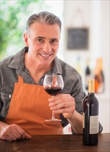 Portrait of man tasting wine