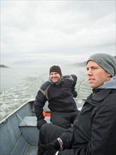 Portrait of men in boat