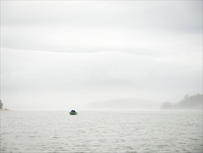 Distant view of people in boat