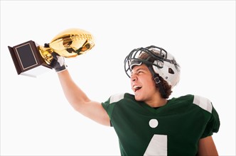 Portrait of American football player celebrating victory