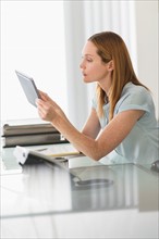 Business woman using tablet pc in office.