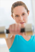 Woman exercising with weights.
