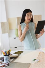 Business woman using tablet pc.