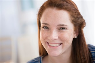 Portrait of smiling teenage girl (14-15)