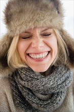 Portrait of smiling woman in fur hat
