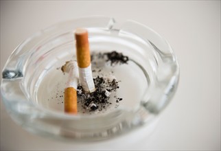 Studio Shot of cigarette butts in ashtrey