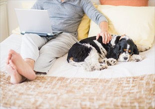 View of mature man using laptop at home