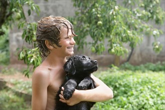 Boy (10-11) with his dog