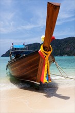 Traditional boat moored on beach