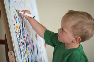 Toddler drawing on wall