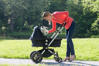 Mother with pram in park