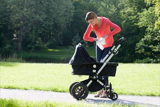 Mother with pram in park