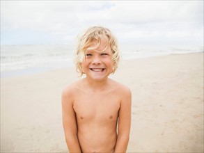 Portrait of boy (6-7) on beach