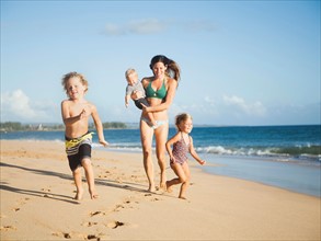 Mother with children on beach