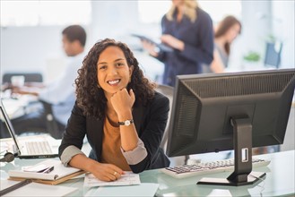 Woman smiling in office.