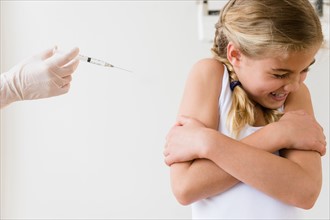 View of girl (8-9) scared of injection