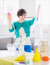 Woman decorating room for party
