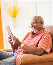 Portrait of men using digital tablet