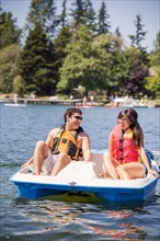 Young man and woman on paddle boat