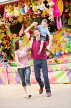 Happy Family with son (4-5) in amusement park