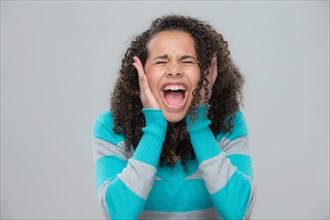 Portrait of girl (12-13) screaming
