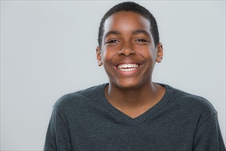 Portrait of teenage boy (14-15) smiling