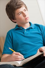 Boy (14-15) studying