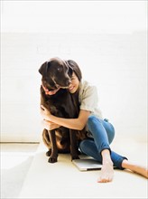 Young woman with labrador