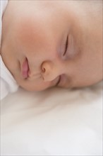 Baby girl (2-5 months) sleeping.
Photo : Jamie Grill