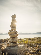 Stack of stones by lake. USA, Utah, Bear Lake.