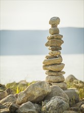 Stack of stones by lake. USA, Utah, Bear Lake.