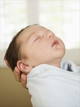 Portrait of newborn baby boy (0-1 months) sleeping.