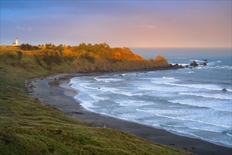 Landscape with lighthouse in distance. USA, Oregon, Cape Blanco.
Photo : Gary Weathers